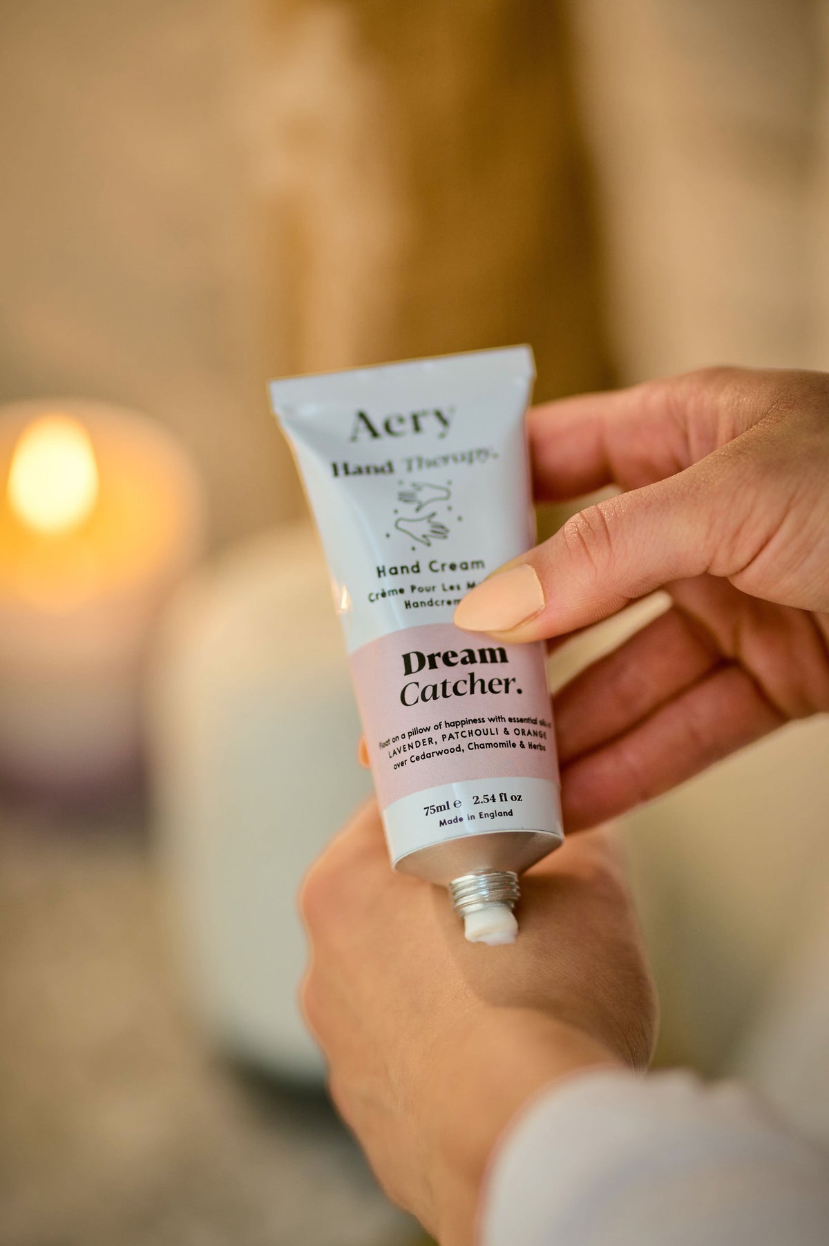 Lilac Dream Catcher hand cream by Aery displayed in hands