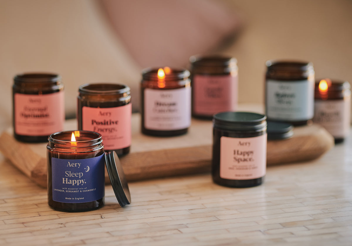 assortment of aery living aromatherapy jar candles in apothecary jars
